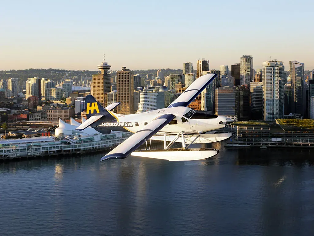 Concierge body images_0000s_0000_Otter over Downtown Vancouver Canada Place.webp
